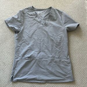 Figs two pocket scrub top, light grey.